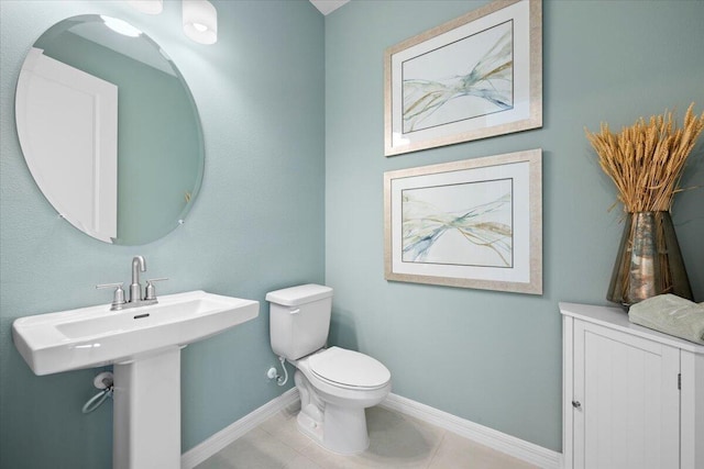 bathroom featuring toilet and tile patterned floors