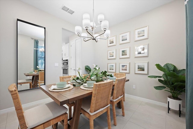 11966 SW Macelli Way, Port Saint Lucie, FL 34987 - dining space with a chandelier, light tile patterned floors, and baseboards