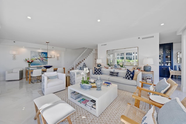 living room with an inviting chandelier