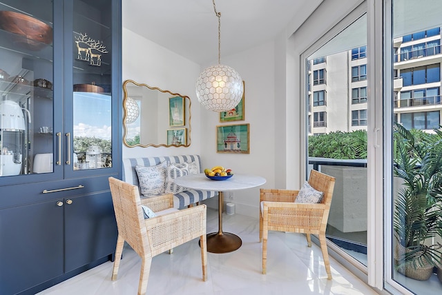 dining space featuring breakfast area and light tile patterned flooring