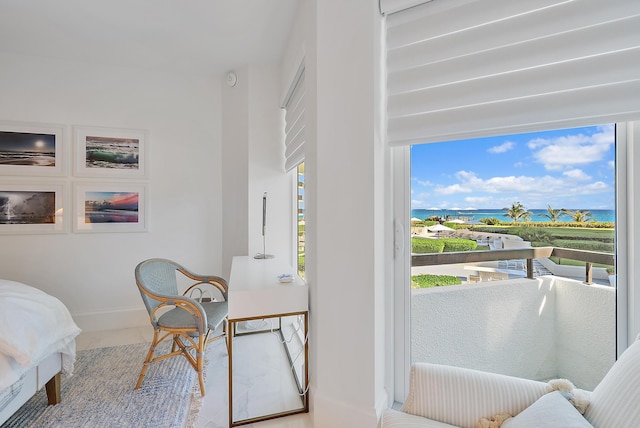 bedroom featuring a water view