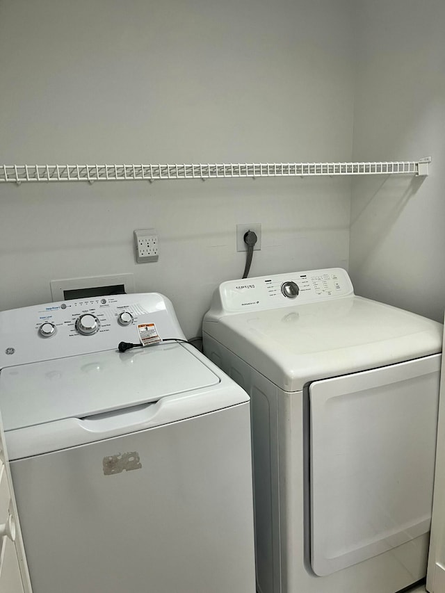 laundry area with washer and clothes dryer