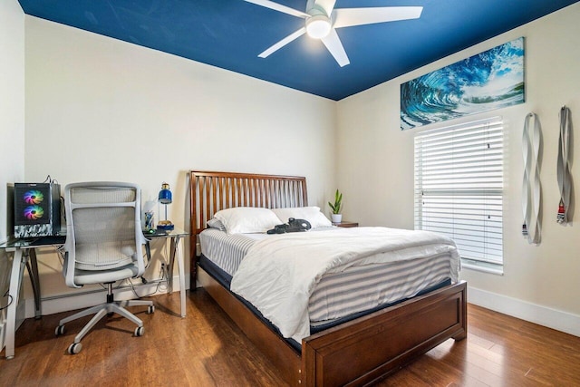 bedroom with ceiling fan and dark hardwood / wood-style floors