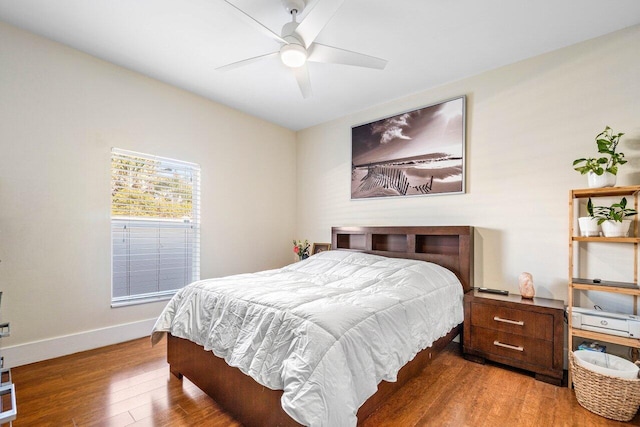 bedroom with ceiling fan and hardwood / wood-style floors