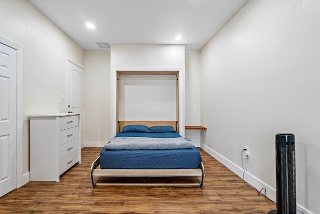 bedroom featuring dark hardwood / wood-style floors