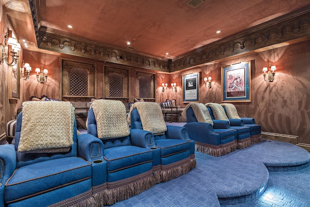 cinema featuring crown molding and wooden walls