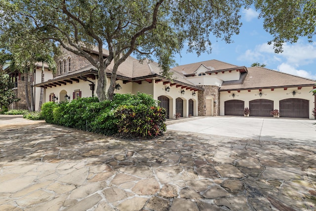 mediterranean / spanish-style house featuring a garage