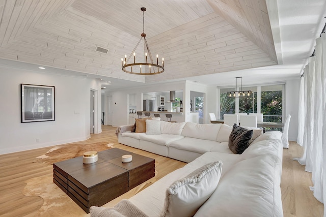 living room with a notable chandelier, light hardwood / wood-style floors, wood ceiling, and a high ceiling