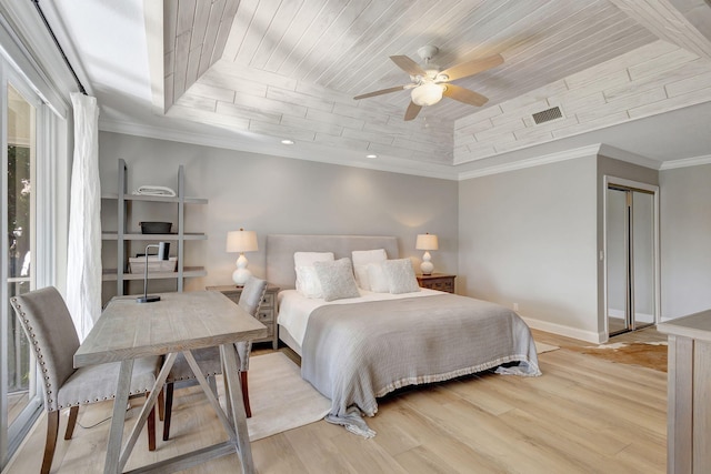 bedroom with wooden ceiling, crown molding, ceiling fan, a tray ceiling, and light hardwood / wood-style floors