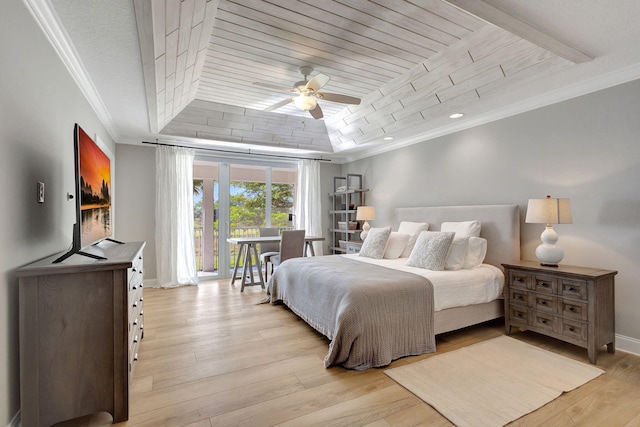 bedroom featuring ceiling fan, light hardwood / wood-style floors, a raised ceiling, and crown molding