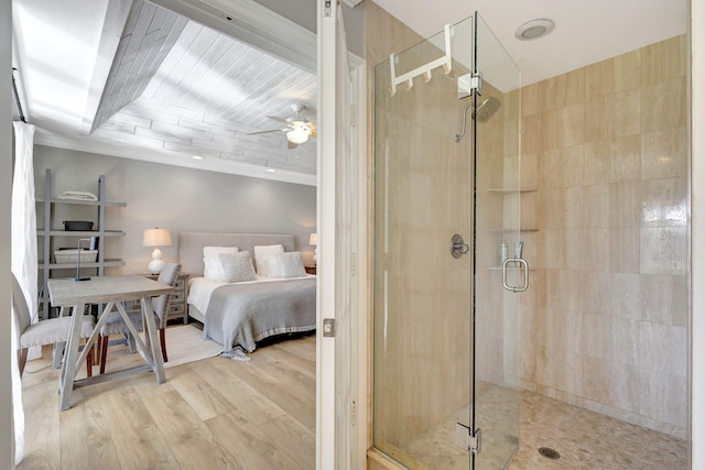 bedroom featuring ceiling fan, crown molding, and light wood-type flooring