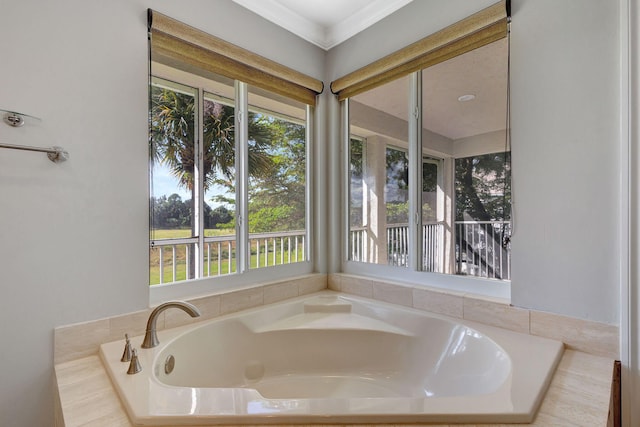 bathroom with plenty of natural light and a relaxing tiled tub