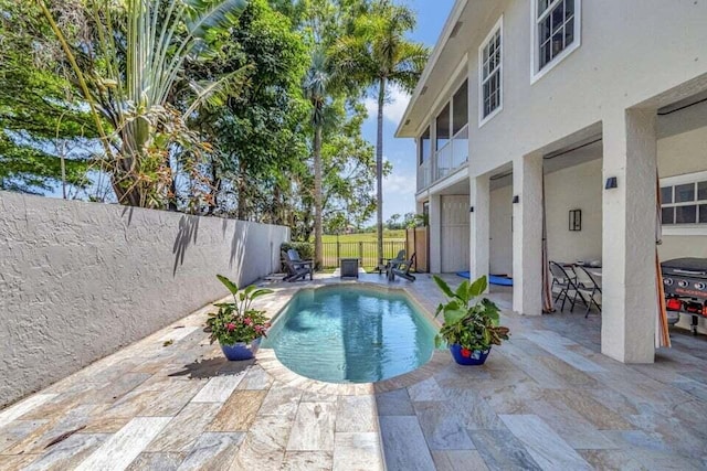 view of pool with a patio area