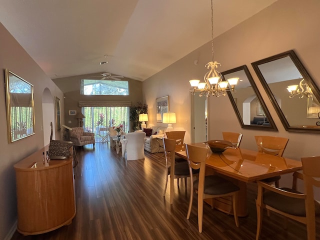 dining area with ceiling fan with notable chandelier, dark wood-type flooring, and vaulted ceiling