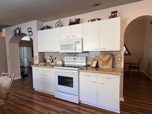 kitchen featuring white appliances, decorative backsplash, stone countertops, dark hardwood / wood-style flooring, and white cabinetry