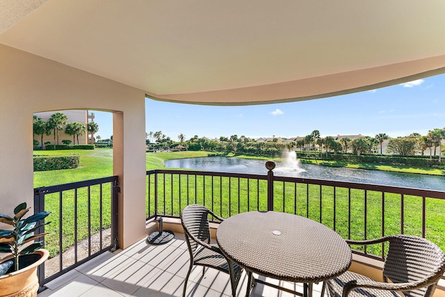 balcony featuring a water view