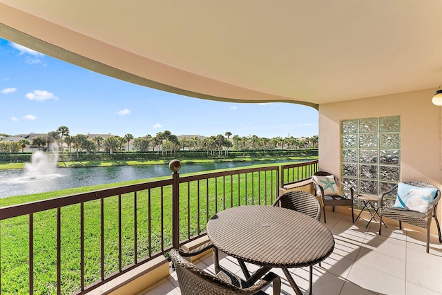 balcony featuring a water view