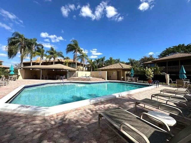 view of swimming pool with a patio area