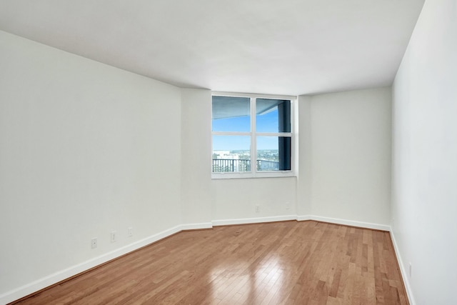 unfurnished room featuring light hardwood / wood-style floors