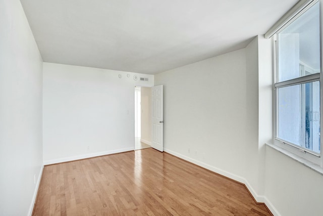 empty room with light wood-type flooring