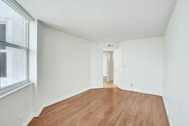 spare room featuring light hardwood / wood-style flooring