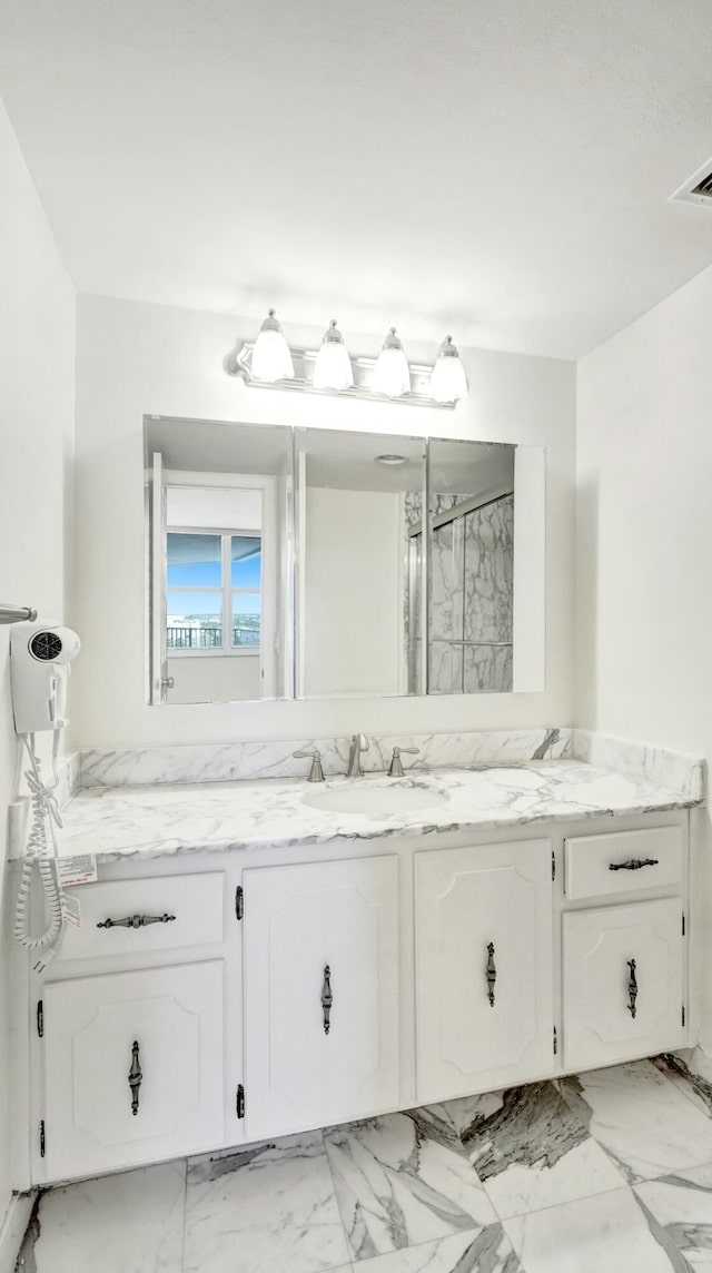 bathroom featuring vanity and walk in shower