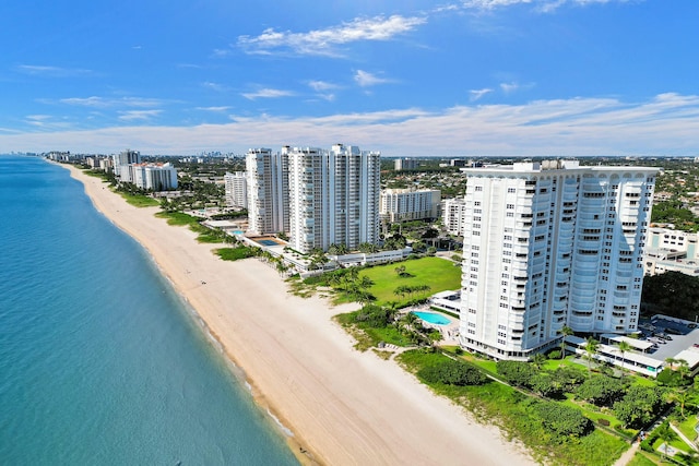 drone / aerial view with a water view and a view of the beach