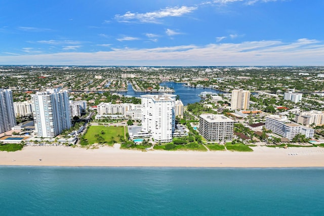 aerial view with a water view and a view of the beach