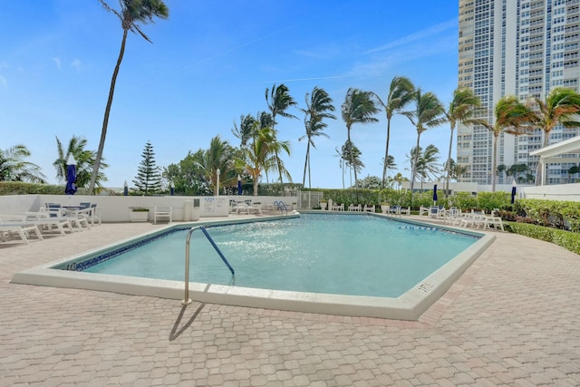 view of swimming pool featuring a patio area