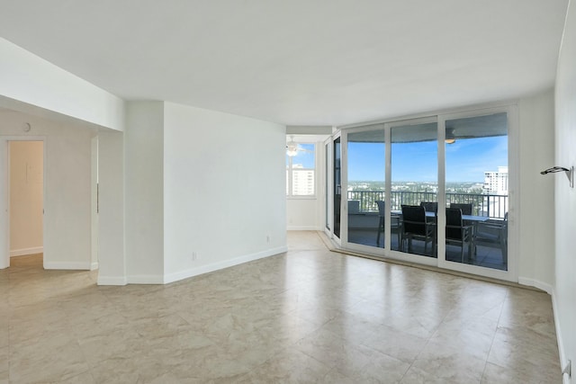 spare room with ceiling fan