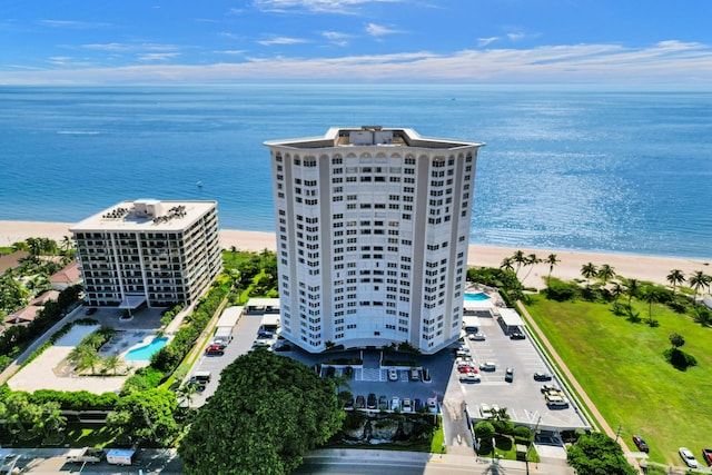 drone / aerial view featuring a view of the beach and a water view