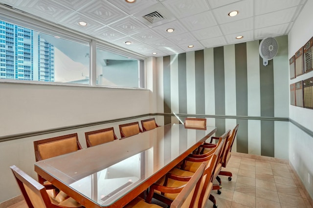 dining area with light tile patterned flooring and a wealth of natural light