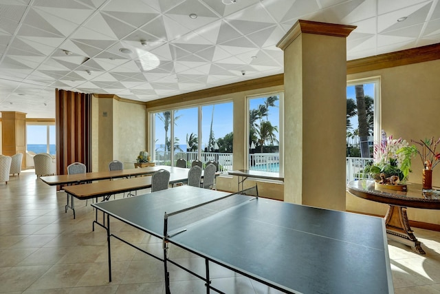 playroom with a water view and light tile patterned floors