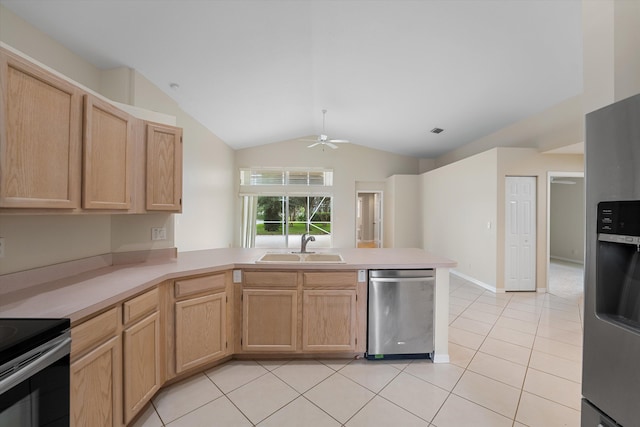 kitchen with sink, light brown cabinets, stainless steel appliances, kitchen peninsula, and lofted ceiling