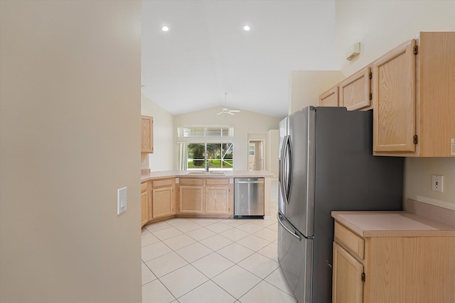 kitchen with light brown cabinets, stainless steel appliances, ceiling fan, and lofted ceiling