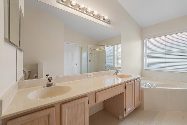 full bathroom with tile patterned flooring, vanity, vaulted ceiling, and independent shower and bath