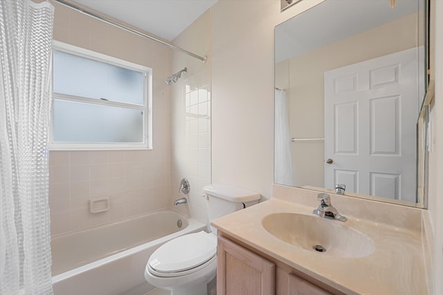 full bathroom with vanity, toilet, and shower / tub combo with curtain