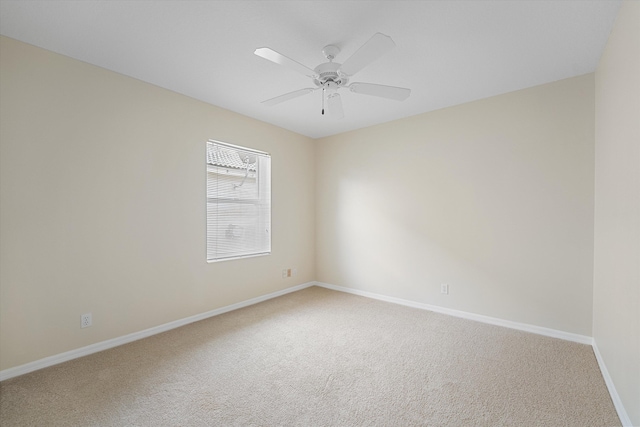 unfurnished room featuring ceiling fan and carpet floors