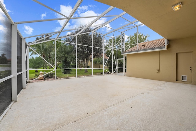 view of patio with glass enclosure