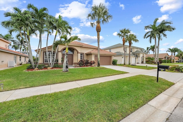 mediterranean / spanish home featuring cooling unit, a garage, and a front lawn