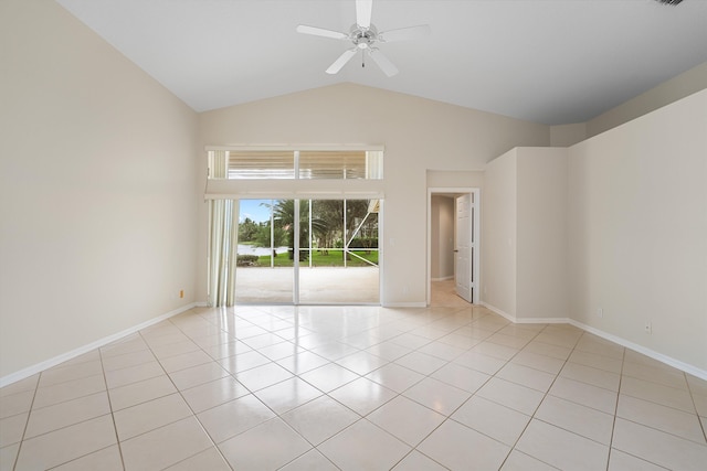 tiled empty room featuring ceiling fan and lofted ceiling