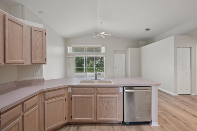 kitchen with sink, light brown cabinetry, vaulted ceiling, stainless steel dishwasher, and kitchen peninsula