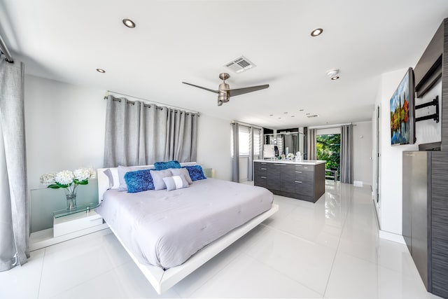 bedroom with ceiling fan and light tile patterned flooring