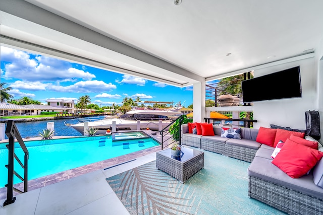 view of pool with a water view, an outdoor hangout area, and a patio