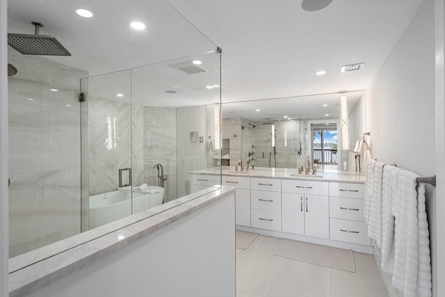 bathroom featuring vanity and an enclosed shower