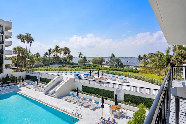 view of pool with a water view