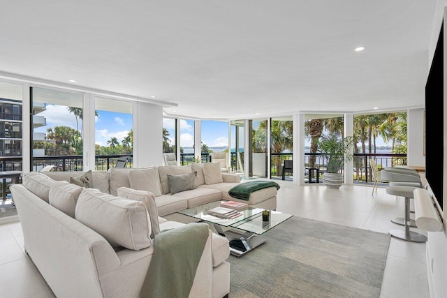 tiled living room featuring expansive windows