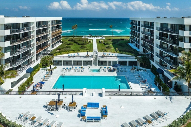 view of swimming pool with a water view