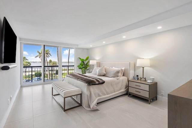 bedroom with access to outside and light tile patterned floors