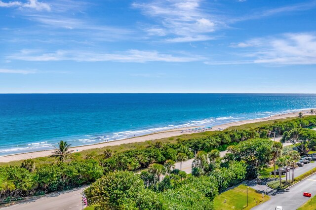 birds eye view of property featuring a view of the beach and a water view